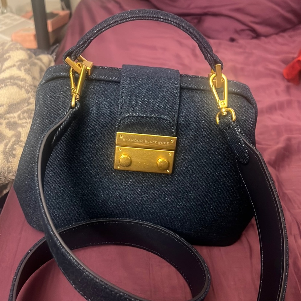 Brandon Blackwood’s Elizabeth Doctor bag in dark denim blue.